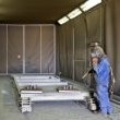 Sandblasting cabinet 12m long x 5m wide x 5m high - trolley with 2 components due for sandblasting 